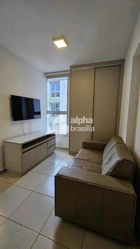 Kitnet Mobiliada 26m² Sala com sofá. rack para computador e TV LCD Quarto com ca...