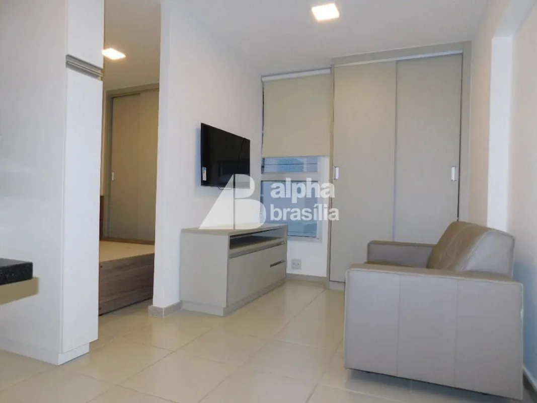 Kitnet Mobiliada 26m² Sala com sofá. rack para computador e TV LCD Quarto com ca...