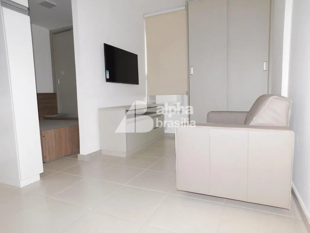 Kitnet Mobiliada 25m² Sala com sofá. rack para computador e TV LCD Quarto com ca...