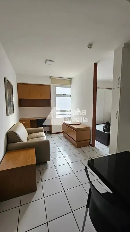 Kitnet Mobiliada 25m²Sala com sofá e rack para computadorQuarto com cama de casa...