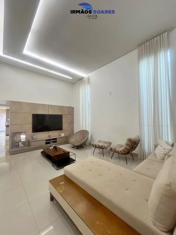 Sala com pé direito duplo painel de tv, sala de jantar integrada a cozinha reple...